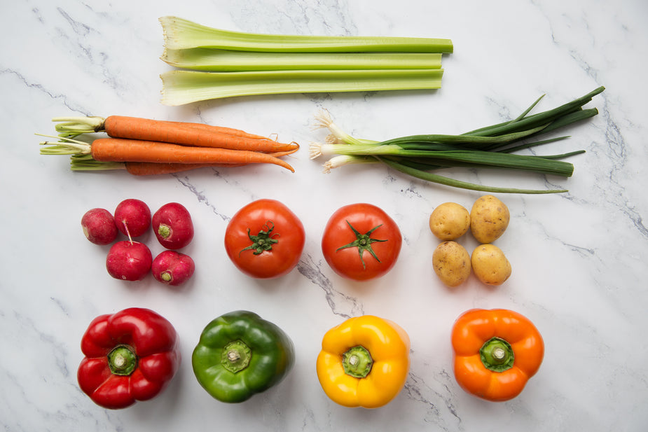 fruits and vegetables on a kitchen counter that were grown from home